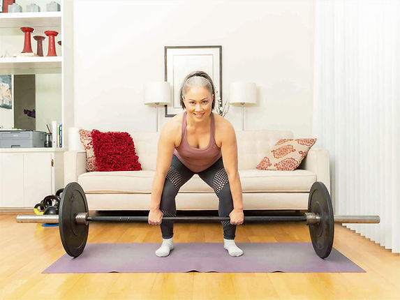 Woman over 50 performing strength training exercises to improve muscle mass and bone health.