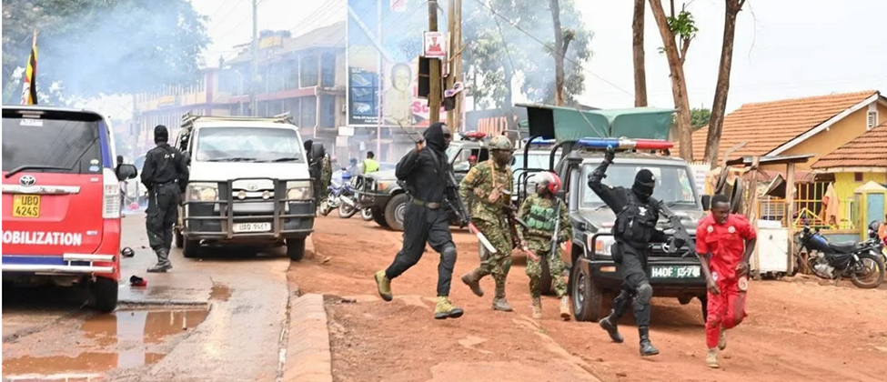 Courtesy photo: NUP mobilizer being assaulted by masked officer