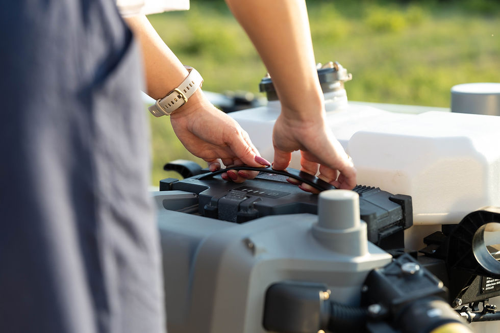 Woman's hands adjusting equipment outside in the daylight, with greenery background.