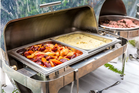 Wedding buffet set up with beef, mashed potatoes and slow roasted carrots