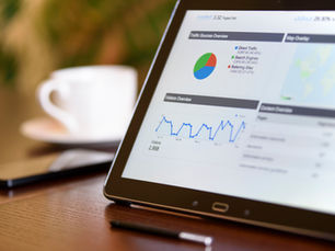 Tablet displaying website traffic and search engine analytics, illustrating B2B SEO performance and organic search growth.