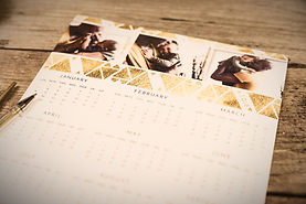 white and gold calendar on brown surface_edited.jpg