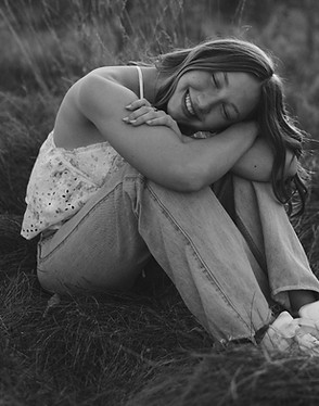 girl sitting in a field