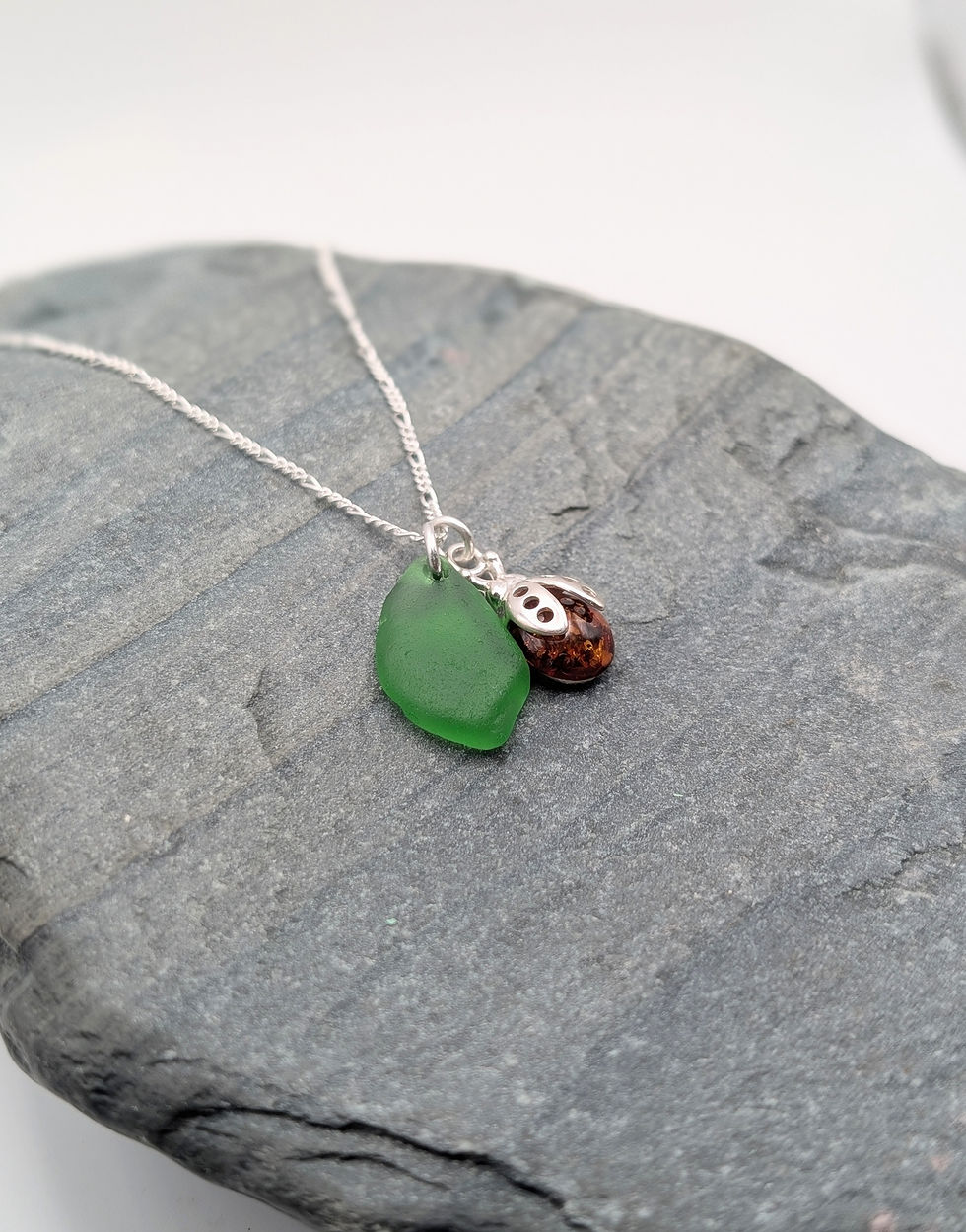 Thumbnail: Sterling Silver Ladybird Charm Necklace with Amber & Green Sea Glass