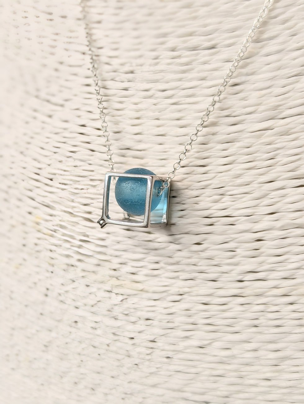 Thumbnail: Sterling Silver Cube Fidget Necklace with Rare Blue Sea Glass Bead
