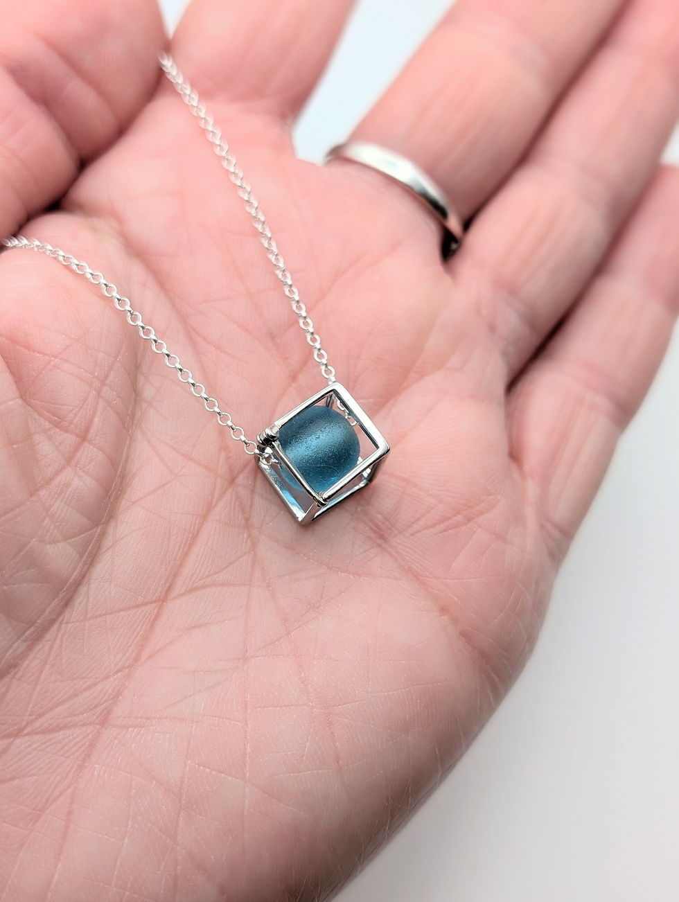 Thumbnail: Sterling Silver Cube Fidget Necklace with Rare Blue Sea Glass Bead