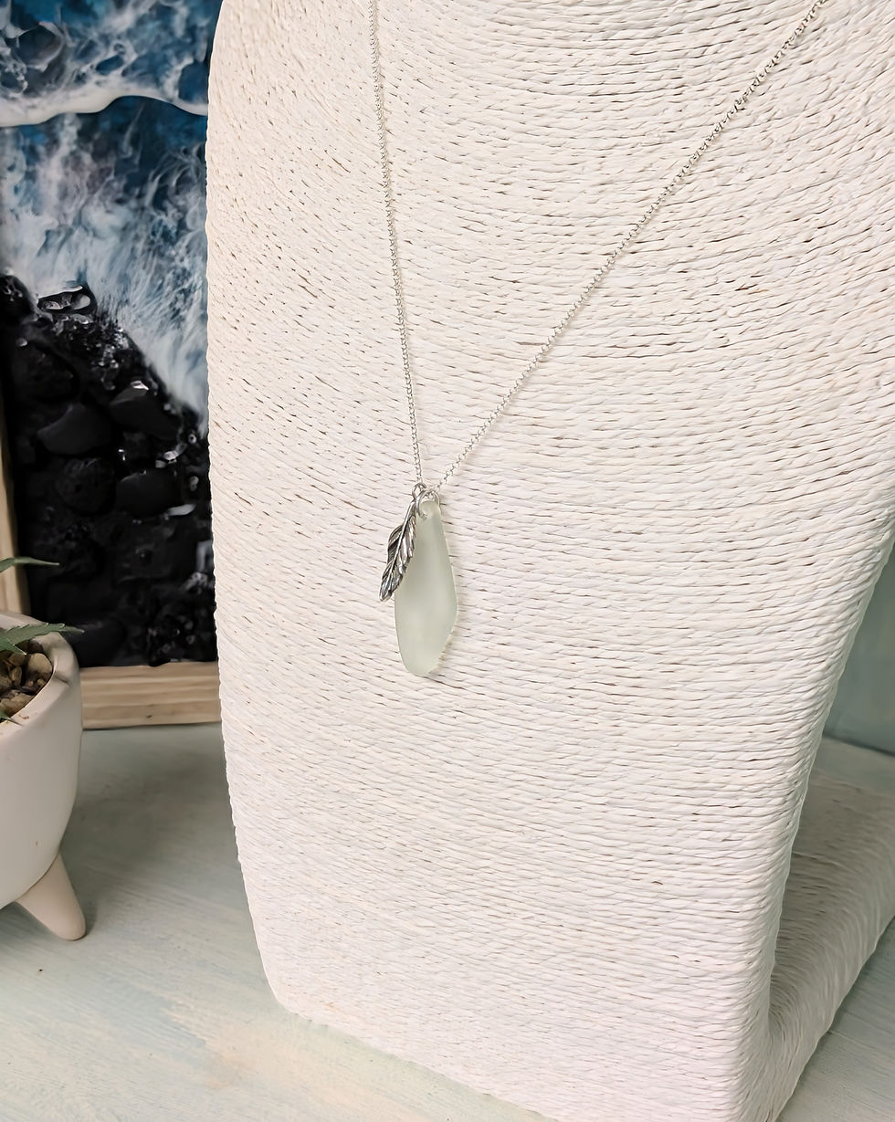 Thumbnail: Sterling Silver Feather Pendant with Pale Green Suffolk Sea Glass