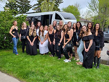 A large group of ladies outside a Calgary shuttle