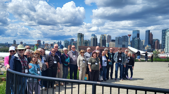 Private group enjoying panoramic Calgary skyline views from Scotsman’s Hill on a YYCTOURS city tour