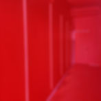 A bright red hallway at Evil corporation Brewing in Calgary by YYCTOURS