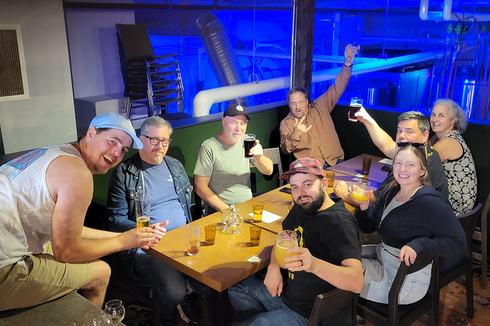 Judges and Polyrhythm Brewing owners Chelsea and Taylor toasting with beers