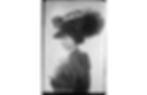 Woman in striped suit, large feathered hat