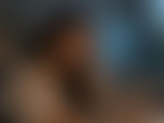 Woman looking out a window with a calm, contemplative expression, illustrating AI anxiety and what's actually hers to worry about in the blog post by Asi Efros