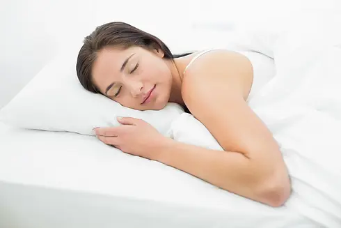 pretty-woman-sleeping-bed.webp