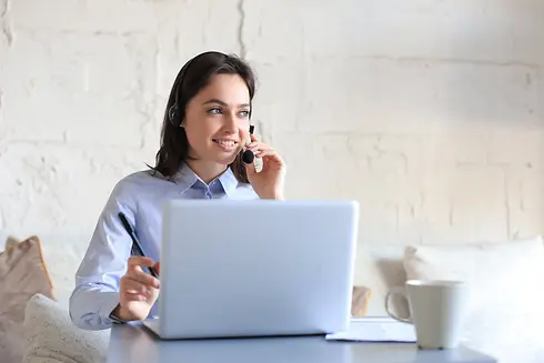 freelance-operator-talking-with-headsets-consulting-clients-from-home-office.webp