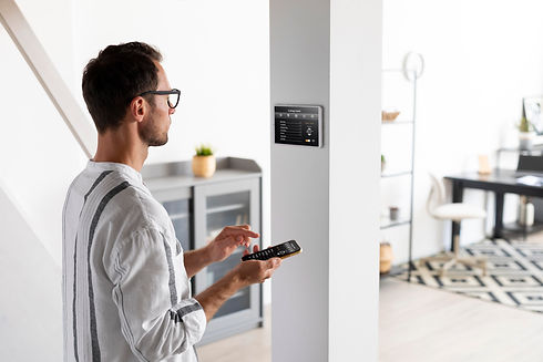 person-using-smartphone-his-automated-home-2.jpg