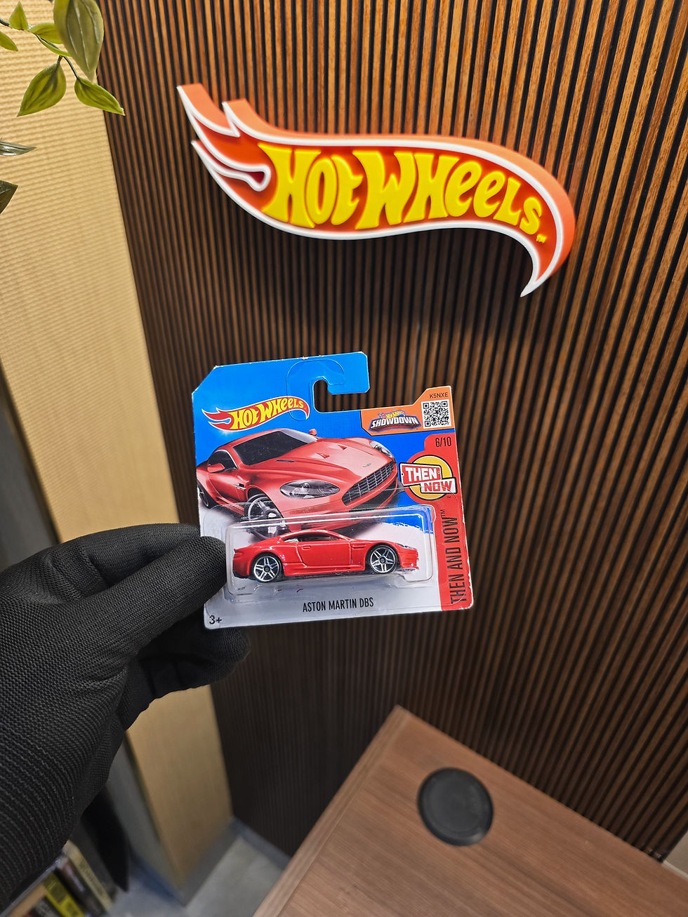 Hot Wheels Aston Martin DBS Red die-cast collectible in original blister packaging