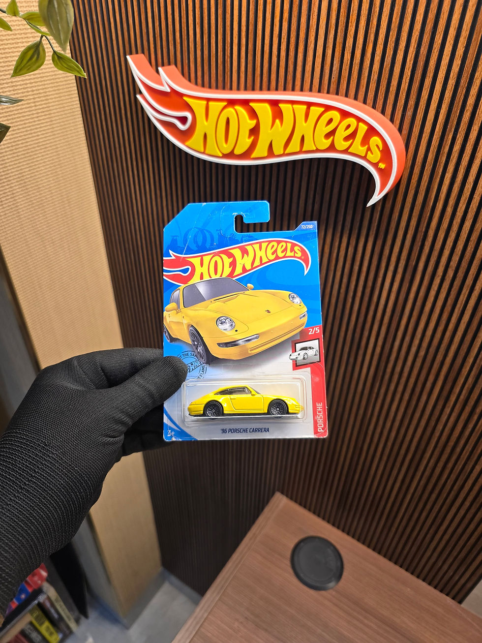 Hot Wheels '96 Porsche Carrera Yellow die-cast collectible in original blister packaging