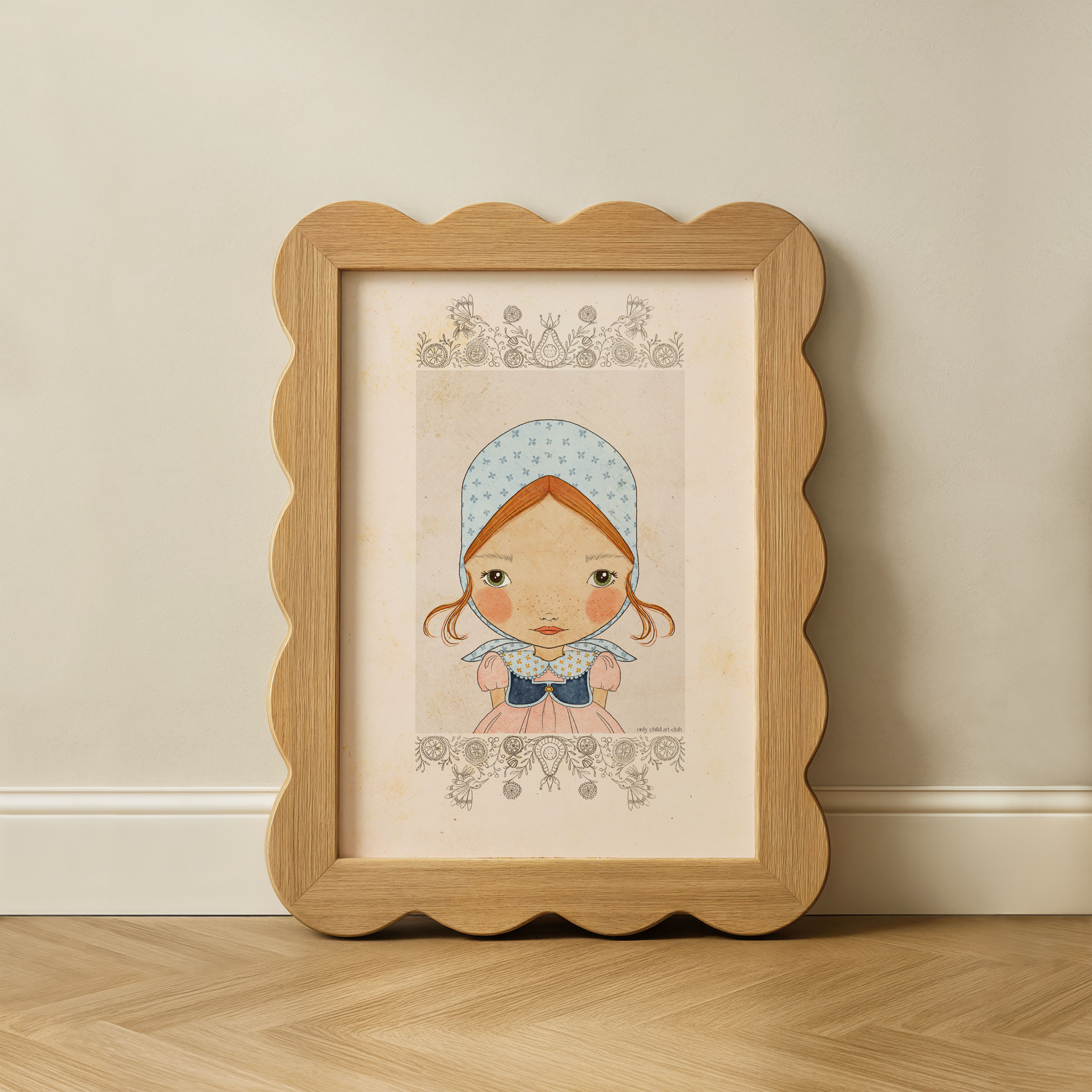 A watercolor print of Mila featuring intricate border details, displayed in a unique scalloped wooden frame to showcase a who