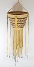 An image of a burden basket hanging on a wall.