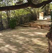 Decking platform, retaining oak wall and landscape stone - in a woodland garden, Newport. Built by Ark Fencing & Garden Services, Cwmbran, South Wales.