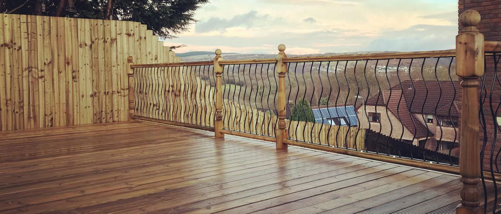 Garden decking with metal balustrade overlooking view in Newport.