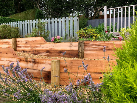 Oak sleeper wall. Installed by Ark Fencing & Garden Services in Cwmbran, South Wales.