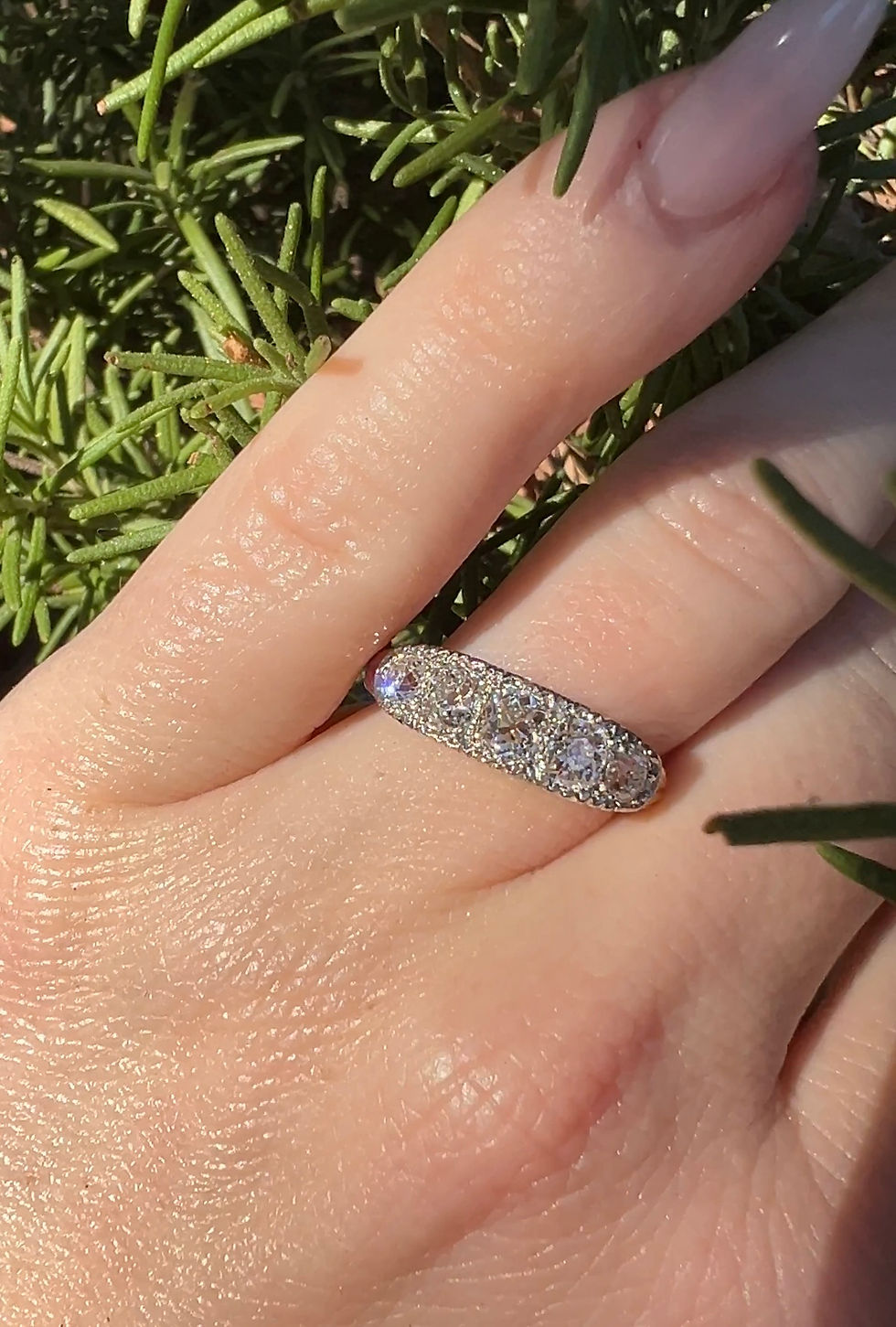 Thumbnail: 1890s Victorian two-tone old mine cut diamond ring with a brilliant cushion cut in a half-hoop design.