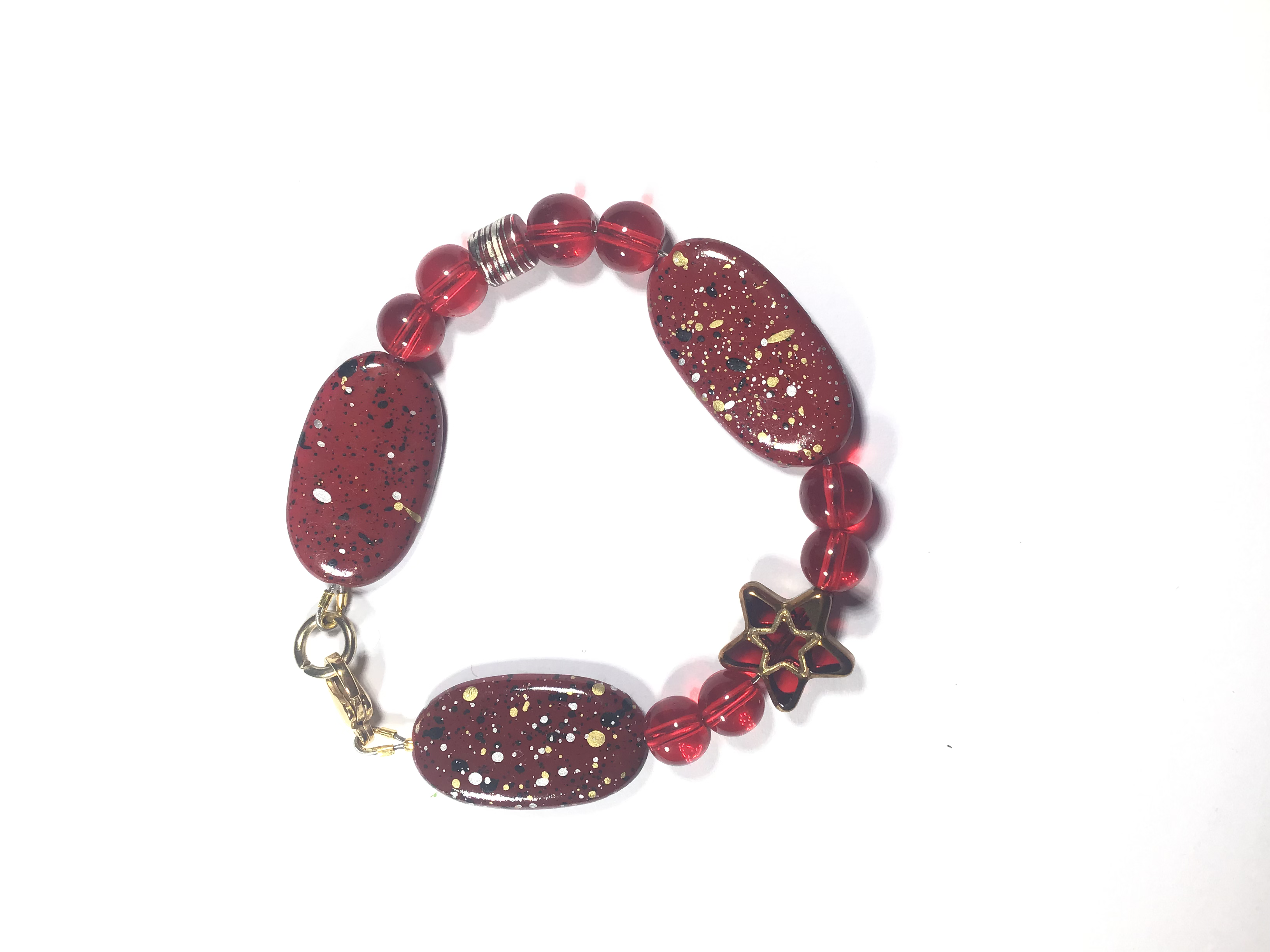 Red Glass Bead Bracelet With A Splash Of Black, Gold, And Silver