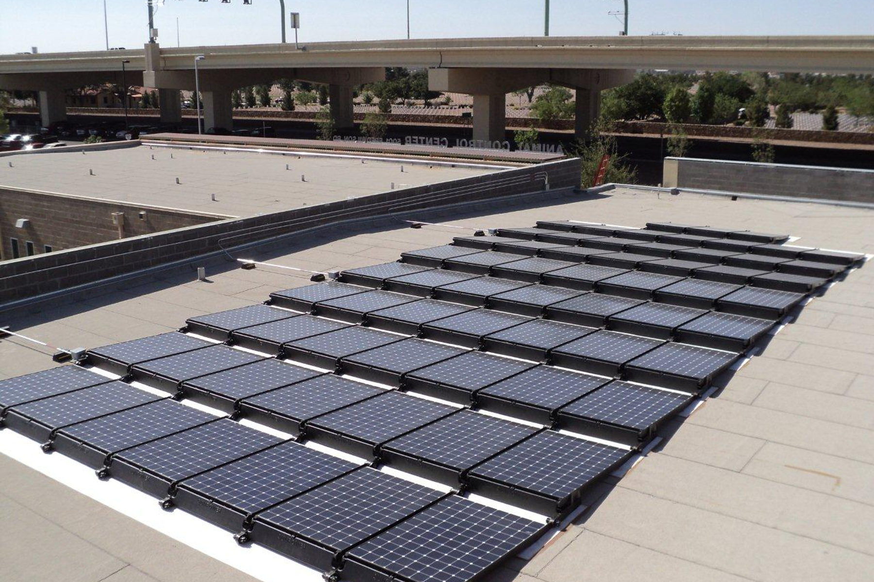 A 20.1 kW DC rooftop array on the City of El Paso's Animal Services facility, modeled at roughly 30,173 kWh per year.
