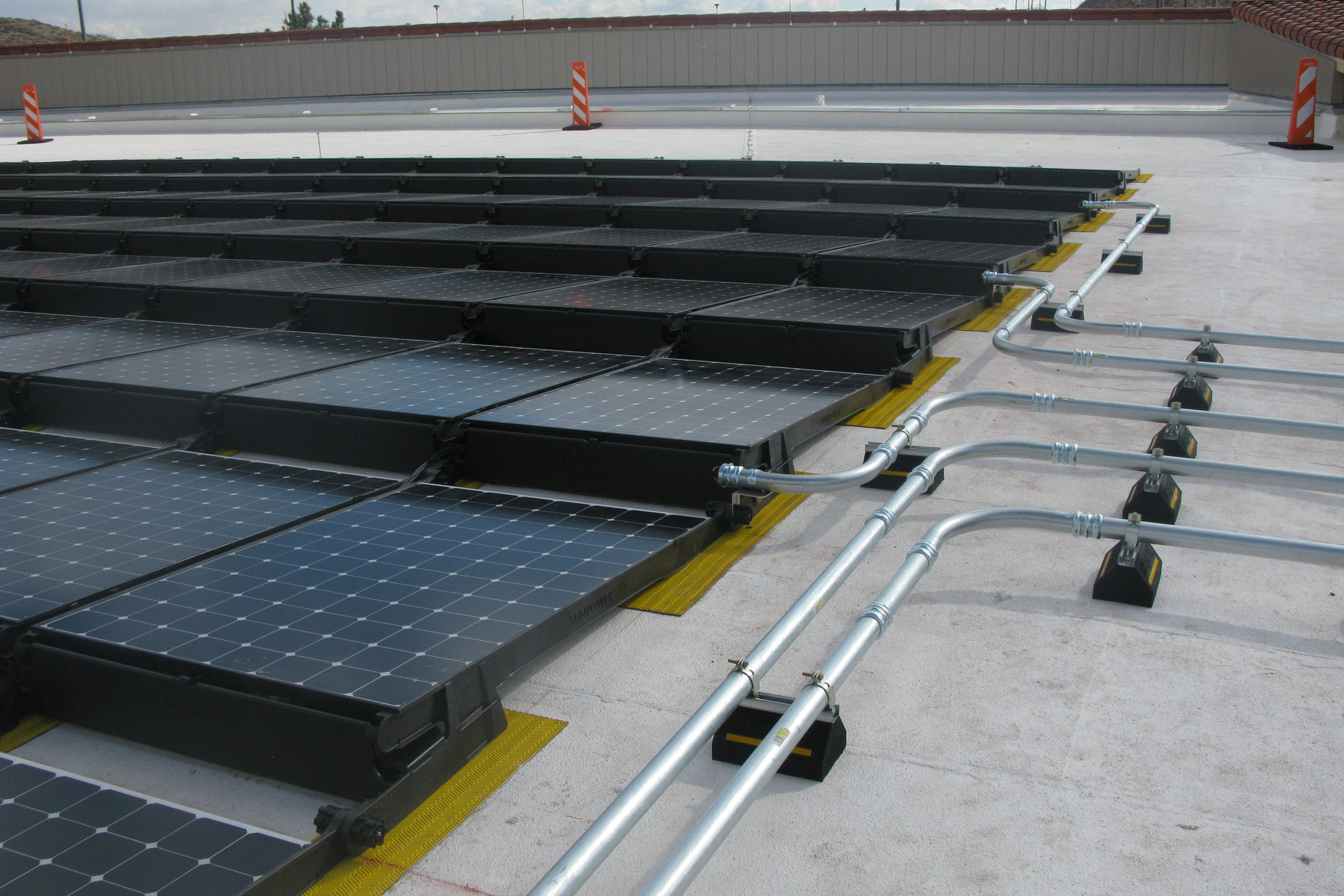 A 76.4 kW DC array at UTEP's Swimming & Fitness Center, part of the athletics complex follow-on to our original campus installation.