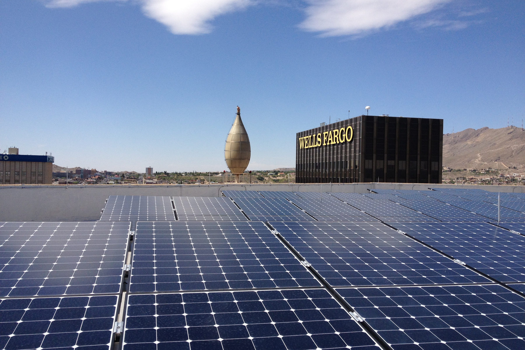A 36.96 kW DC rooftop array on El Paso Electric's headquarters at 100 N. Stanton — a client that evaluates solar installations for a living.