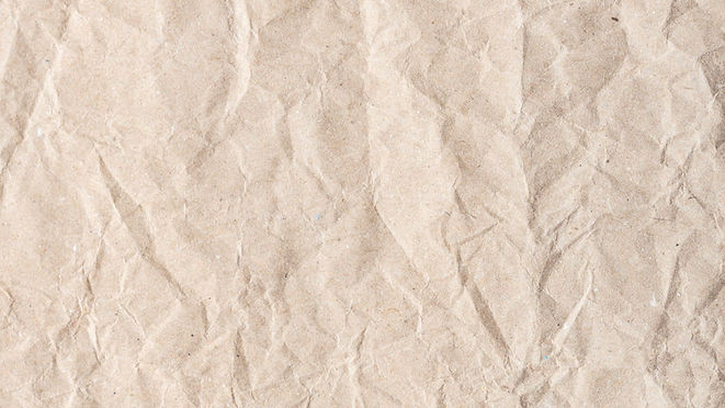 Crumpled light brown paper texture