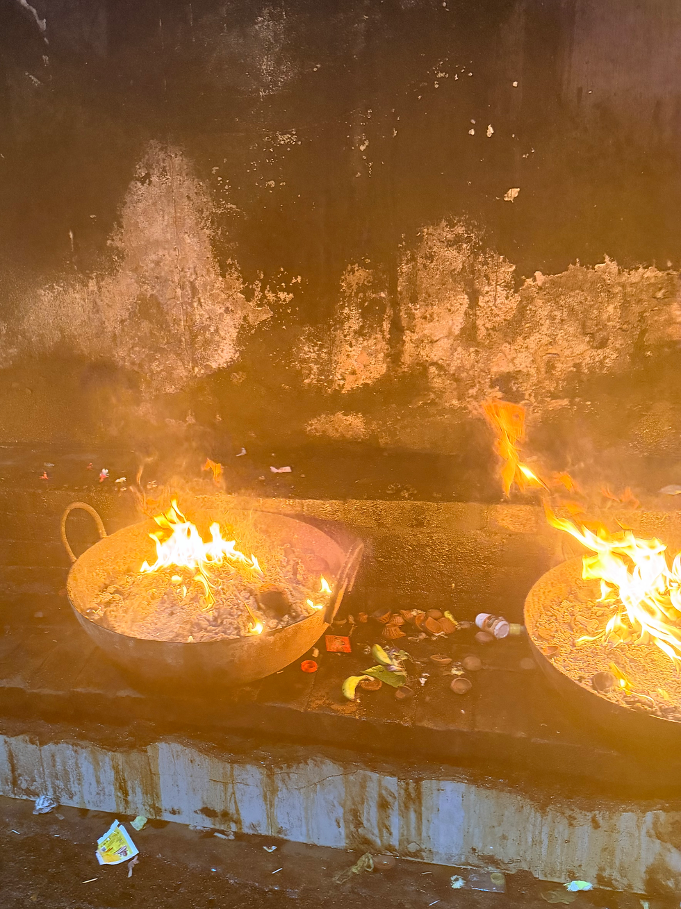two large caldrons of fire for offerings at a temple