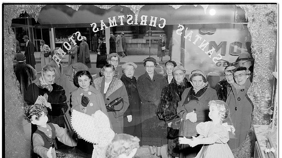People looking at the Christmas window 