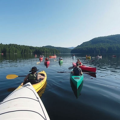 canoes and kayaks with people on a lake.jpg