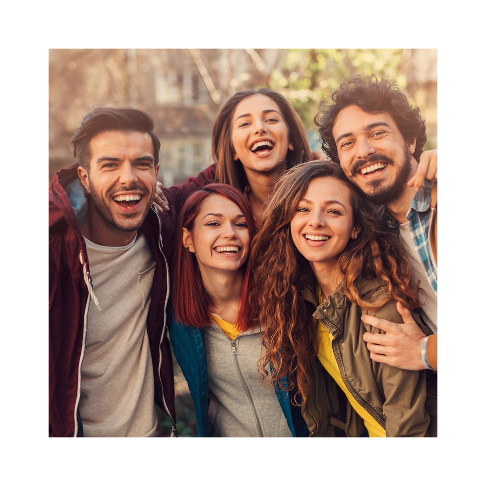 A group of five friends smiling.