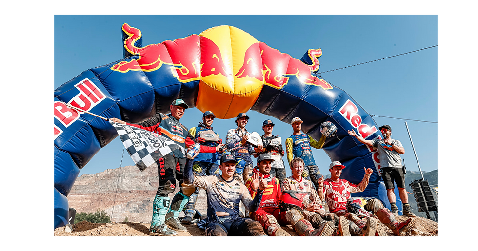 Red Bull dirt bikers under the big inflatable Red Bull banner.