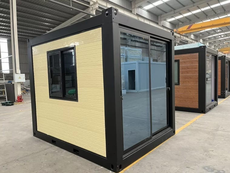 Modern prefabricated backyard pod with glass sliding doors.