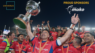 Team of athletes celebrating with hands in the air holding trophy. Univerus and Tasman Mako logos in corners.