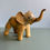 Thumbnail: Vintage Handmade Elephant Figurine Made with Crushed Oyster Shells Trunk Up
