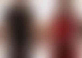 Pregnant couple holding hands at sunset in Raglan at the beach on a maternity photoshoot