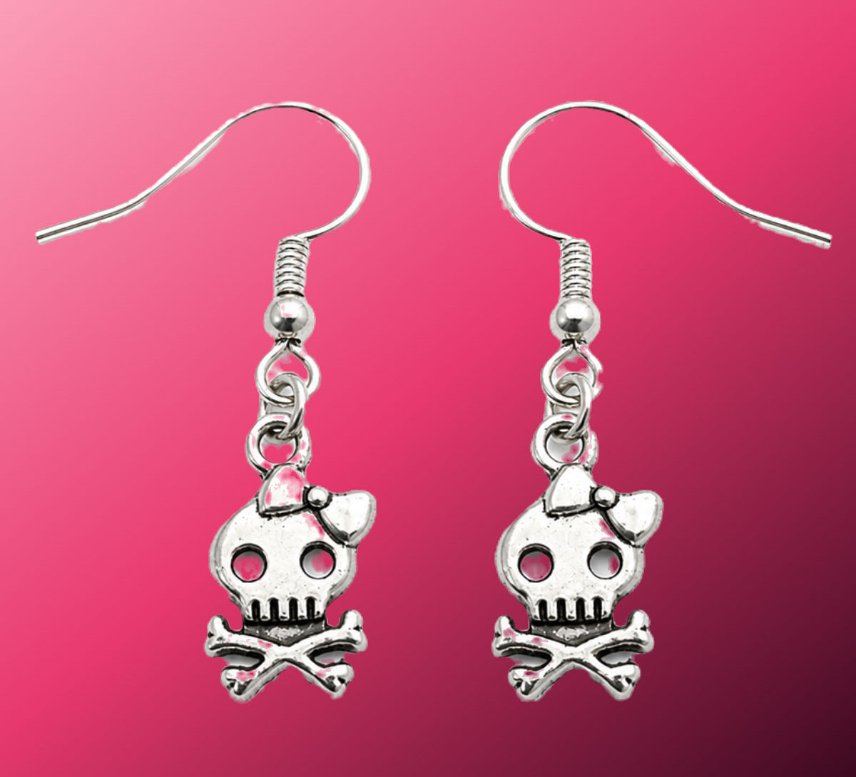 Silver skull earrings with bow and crossbones design