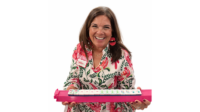 Debbie with Mahjong tiles in hand_edited_edited.png