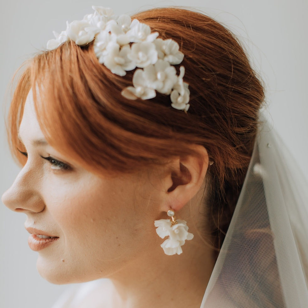 Thumbnail: Gold plated headband embellished with ivory clay flowers and ivory pearls.