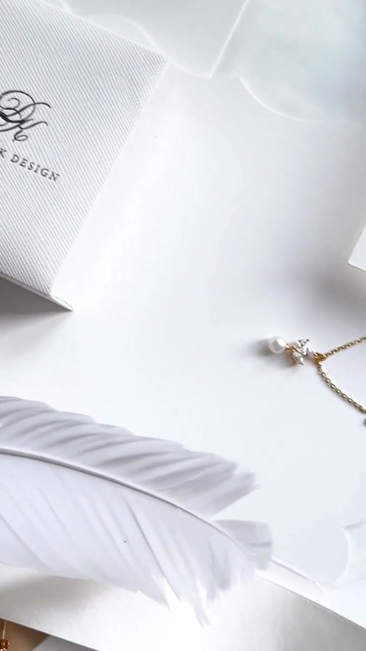 Thumbnail: Gold necklace with pendant of three marquise shape cubic zirconia and ivory pearl