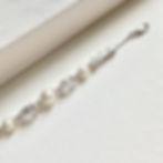 Silver bracelet with ivory pearls and pear shape cubic zirconia