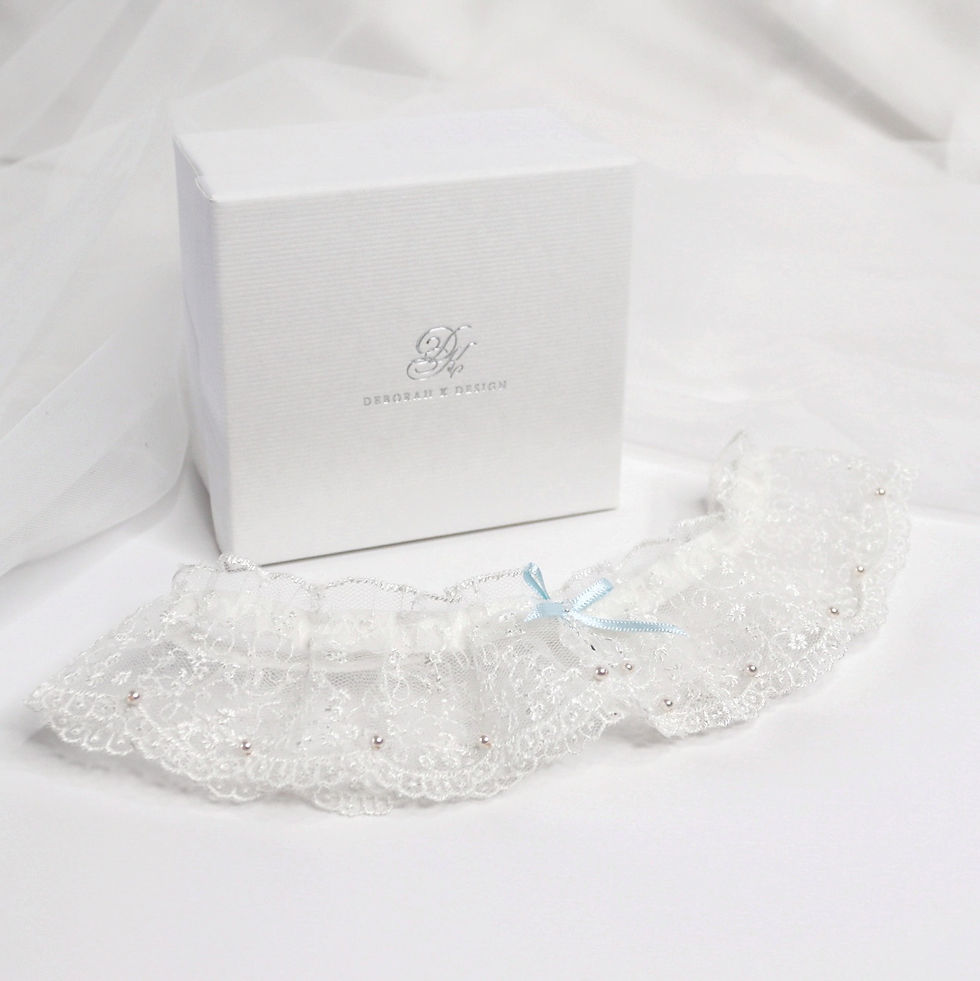 Thumbnail: Deep frill gathered embroidered tulle lace bridal garter embellished with tiny pearls, crystals and blue bow