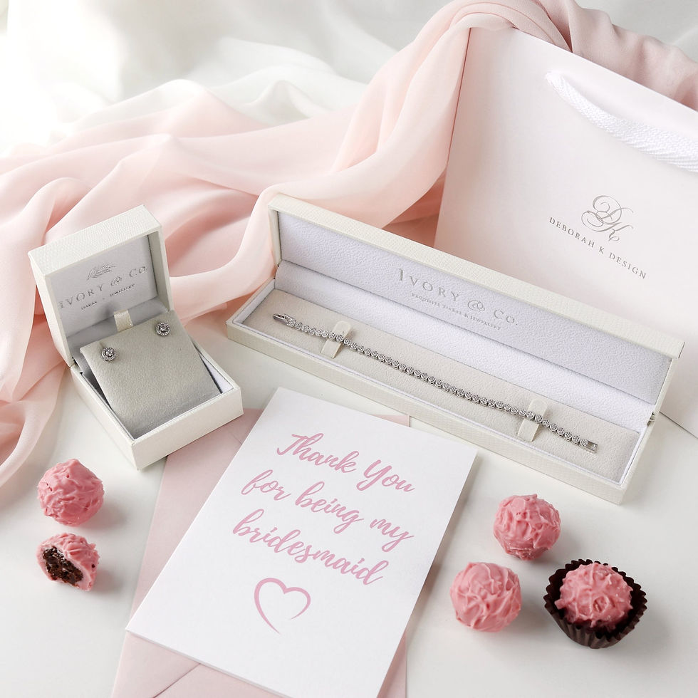 Thumbnail: Silver cubic zirconia stud earrings with silver cubic zirconia tennis bracelet displayed in gift box