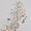 Thumbnail: Silver wire bridal headpiece embellished with ivory clay flowers, diamanté and ivory pearls